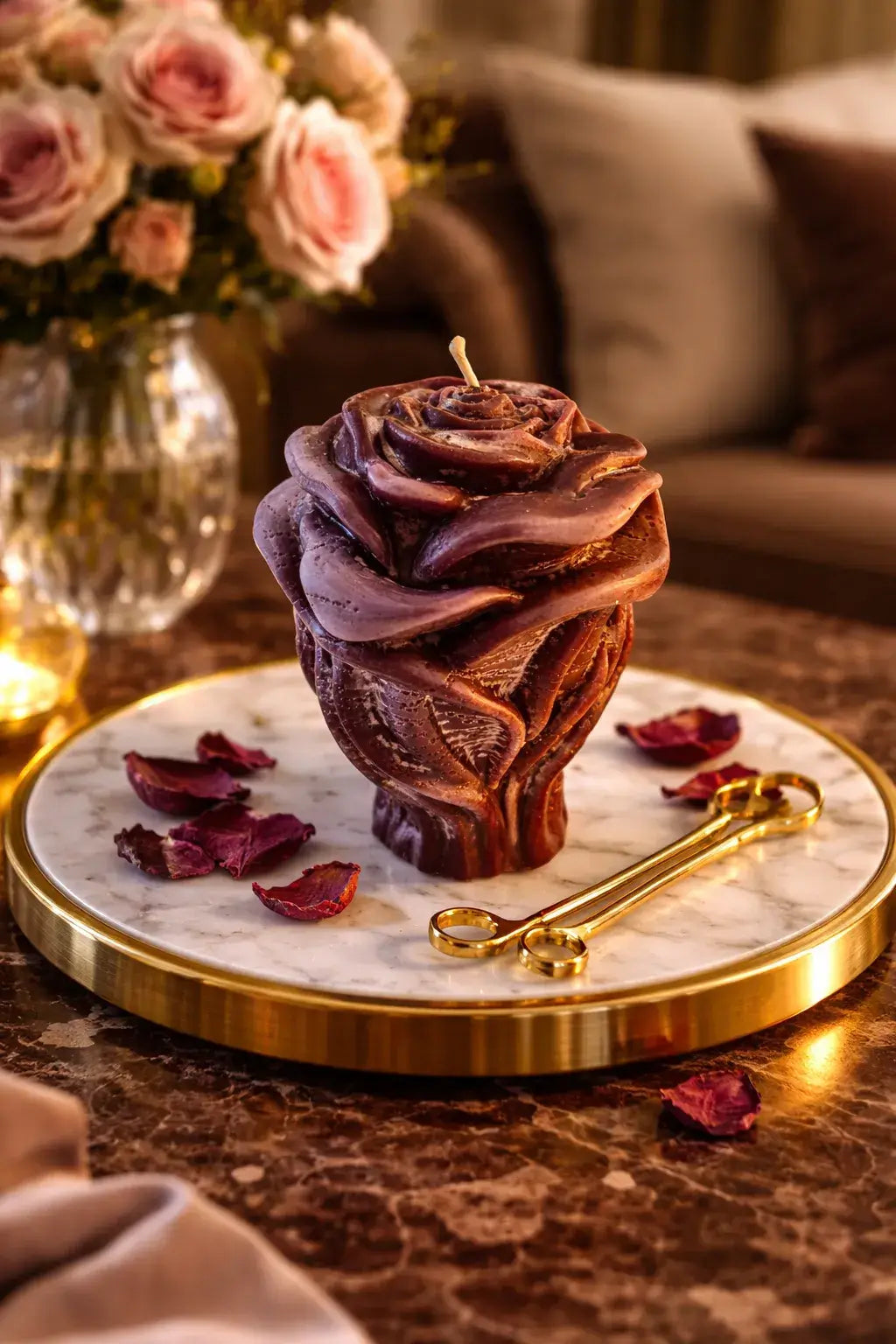 Vanilla Praline Decorative Candles in the shape of a rose on a marble tray with rose petals.