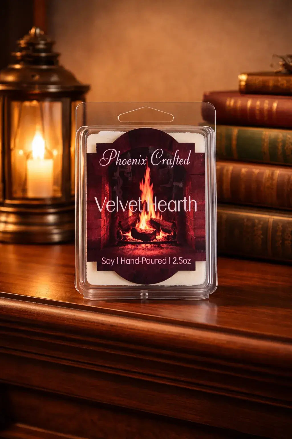 Clear plastic clamshell of white wax melts with label 'Phoenix Crafted Velvet Hearth' showing a fireplace.