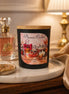 Viva La Juicy Candle displayed on a decorative table, surrounded by luxurious decor and soft lighting.
