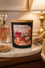 Viva La Juicy Candle displayed on a decorative table, surrounded by luxurious decor and soft lighting.