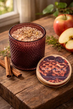 Warm Apple Pie Decorative Candles in a stylish amber jar surrounded by cinnamon sticks and fresh apples.