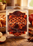 Clear plastic clamshell of cream wax melts labeled 'Phoenix Crafted Warm Apple Pie' on a wooden table with apples.