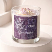 White Sage & Lavender Candle in a glass jar on a pedestal with decorative label and lavender top.