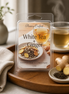White Tea & Ginger Wax Melts in packaging on a wooden tray with ginger and tea, representing a refined wellness scent.