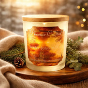 Winter Solstice Glow Candle from Phoenix Crafted, featuring a warm glow and elegant packaging with wintery decor.