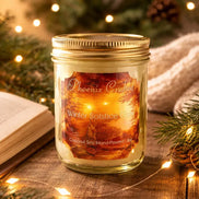 Winter Solstice Glow Candle in a glass jar surrounded by festive holiday lights and greenery.
