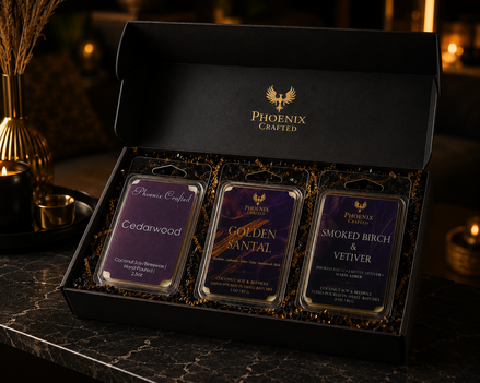 Cedarwood, Golden Santal, and Smoked Birch & Vetiver wax melts arranged together as the Woods & Embers discovery set.
