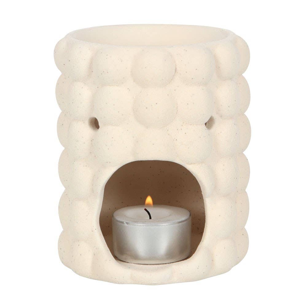 Cream speckle bubble tealight wax warmer with a trendy bubble design and a candle inside.