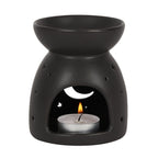 Black moon cut out oil burner featuring a crescent moon and star design, perfect for Halloween decor.