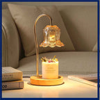 Lily of the Valley Solid Wood Candle Warmer Lamp illuminating a fragrant jar candle on a stylish table.