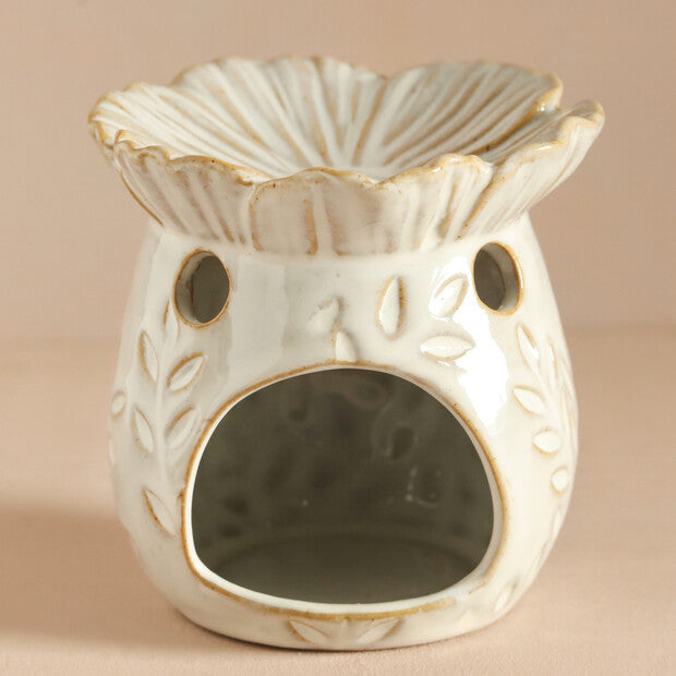 ceramic bee wax melt warmer featuring a floral design and open flower dish for wax melts.