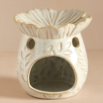 ceramic bee wax melt warmer featuring a floral design and open flower dish for wax melts.