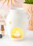 Vase shaped oil burner and wax warmer with a textured finish and soft flickering glow, enhancing home relaxation.