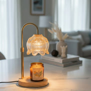 Lamp warmer for candles with dimmable light and timer, warming a jar candle on a stylish countertop.