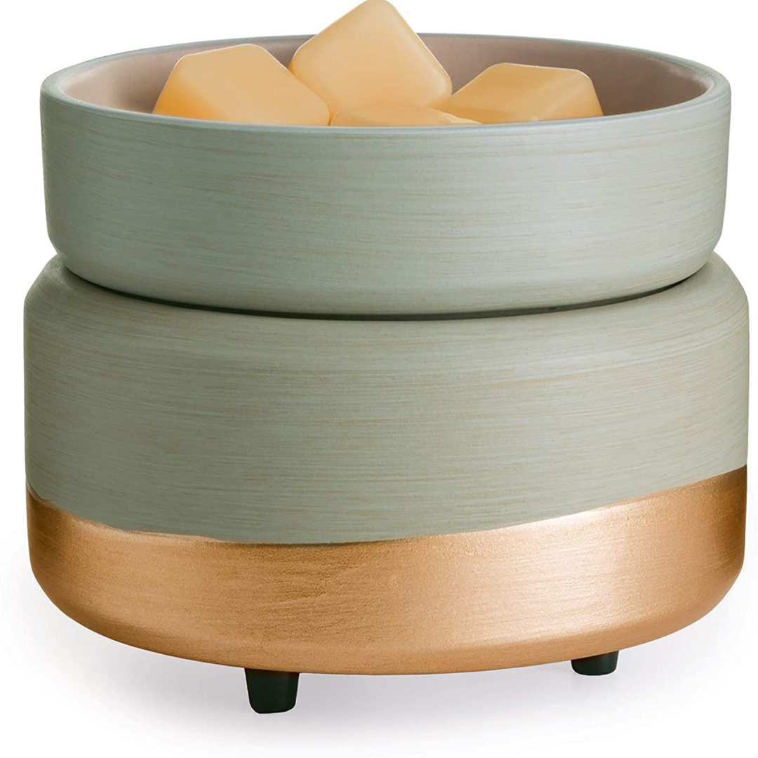 earth-tone candle and wax melt warmer with wax melts in removable dish.