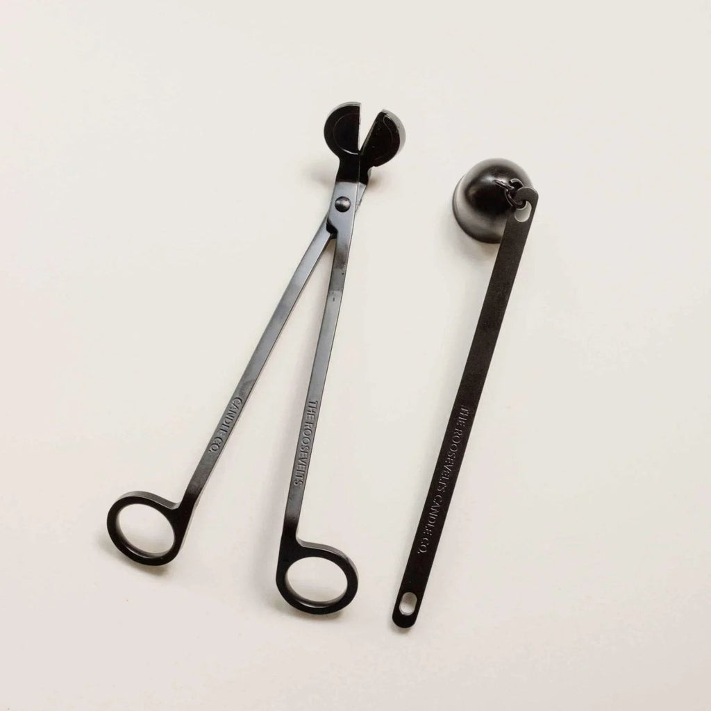 Brass candle snuffer tool and wick trimmer set for candle care and maintenance.