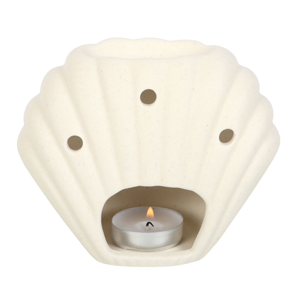 seashell oil burner for home decor in a neutral stone color with a tealight candle.