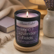 Linen & Lavender Fields candle glowing softly, featuring lavender fields imagery and premium wax blend.