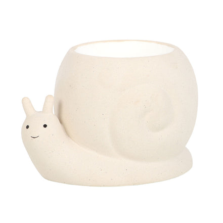 Beige speckled snail-shaped wax warmer with open-top round bowl shell, white interior, smiling face and black dot eyes on a white studio background