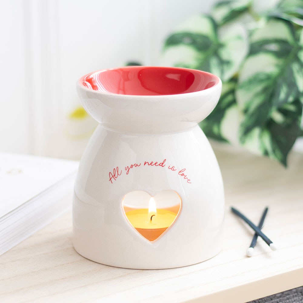 Valentine's Day Heart Oil Burner and Wax Warmer with heart cut out and 'All you need is love' text.