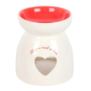 Valentine's Day Heart Oil Burner and Wax Warmer in white ceramic with red interior and heart cutout design.