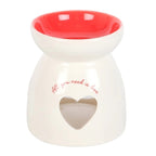 Valentine's Day Heart Oil Burner and Wax Warmer in white ceramic with red interior and heart cutout design.