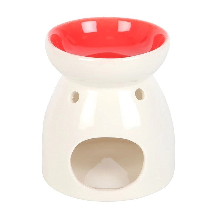 Valentine's Day heart oil burner featuring a stylish white ceramic design with a red bowl and heart cut out.