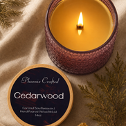 Lit Cedarwood candle in textured purple glass with a wooden wick; round wooden lid labeled 