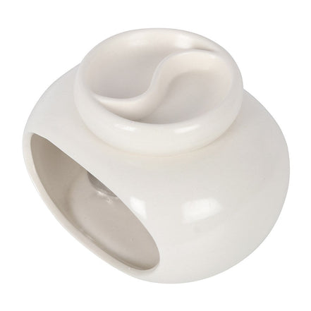 Glossy white ceramic double-bowl wax warmer with round hollow base, arched front opening and two top wells separated by an S-shaped divider.